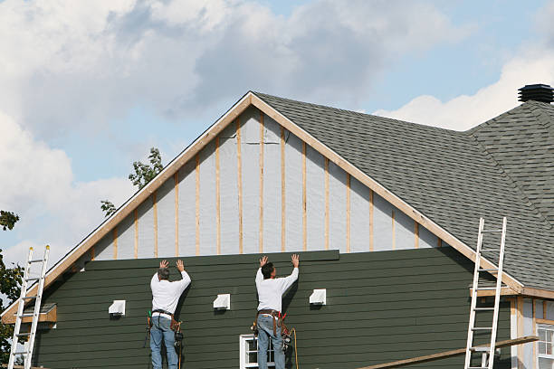 Professional Storm Damage Siding Repair technician working in Halifax, PA